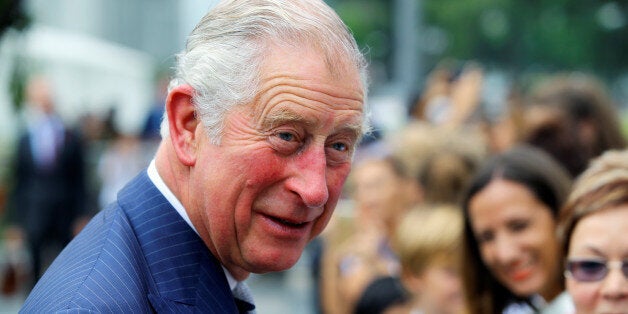 Britain's Prince Charles speaks to people after laying a wreath at the Cenotaph war memorial in Singapore October 31, 2017. REUTERS/Calvin Wong