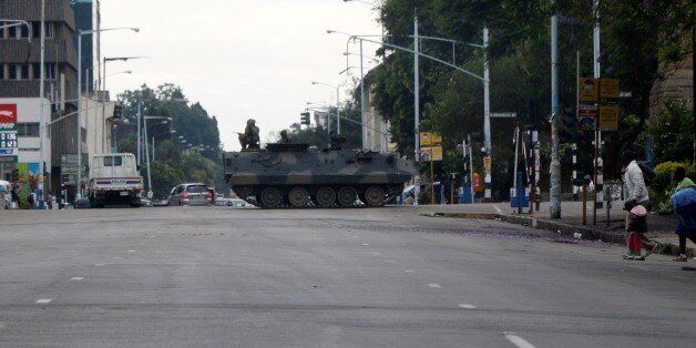 HARARE, ZIMBABWE - NOVEMBER 15 : A tank seals off a main road to the Zimbabwe high court within the military activities taking place in Harare, Zimbabwe on November 15, 2017. President Robert Mugabe and his family have been detained following military intervention in capital Harare, which an army spokesman and the ruling party insisted Wednesday was not a coup. Military officers appeared on television early Wednesday to make a statement saying they were targeting criminals around President Robert Mugabe. (Photo by Stringer/Anadolu Agency/Getty Images)