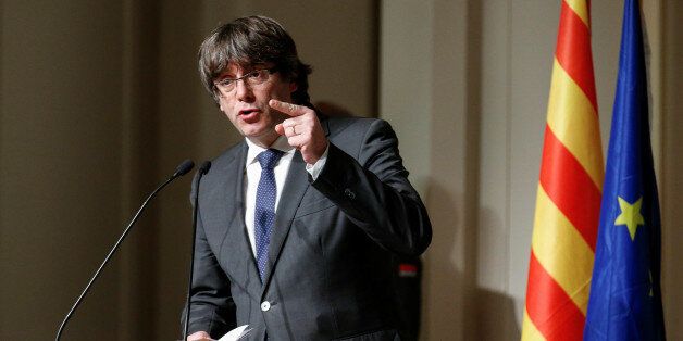 Former Catalan leader Carles Puigdemont gestures while delivering a speech to Catalan mayors in Brussels, Belgium, November 7, 2017. REUTERS/Pascal Rossignol