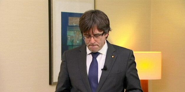 Sacked Catalan President Carles Puigdemont makes a statement in this still image from video calling for the release of