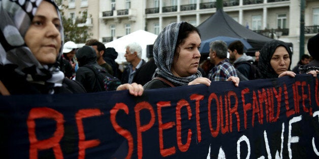 Syrian women protest at Syntagma square in central Athens, Greece. Families of Syrians refugees marched to the German embassy in Athens, on November 8, 2017, demanding the right to reunificate with their families in Germany. Refugees are on hunger strike the last 8 days having camped in Constitution Square, central Athens, opposite the Parliament. (Photo by Panayotis Tzamaros/NurPhoto via Getty Images)