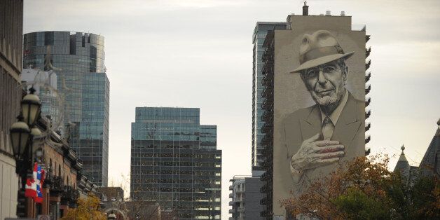 A mural of musician Leonard Cohen is seen on a building on November 7, 2017 in downtown Montreal.Leonard Cohen's songs strived for the universal and his voice was often solemn, yet the courtly songwriter had plentiful moments of joy and deadpan humor. One year after Cohen died at age 82, an array of artists testified to his far-reaching impact with a concert the evening on November 6, 2017 whose somber yet graceful tone befitted the celebrated singer and poet. Before more than 21,000 people at the Bell Centre arena in Cohen's native Montreal, the tribute built around short videos of his well-traveled life which included years of artistic retreat on the Greek island of Hydra and a late-age stint as a Buddhist monk in California. / AFP PHOTO / Marc BRAIBANT (Photo credit should read MARC BRAIBANT/AFP/Getty Images)