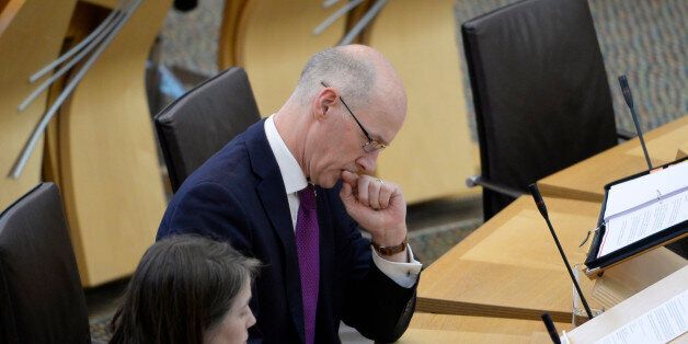EDINBURGH, SCOTLAND - SEPTEMBER 26: Scotland's Deputy First Minister John Swinney prepares to update the Scottish Parliament on talks held in London this week between the Scottish Government and the UK Government to try to resolve disagreements over Brexit, in response to a Topical Question, on September 26, 2017 in Edinburgh, Scotland. The Scottish Government is opposed to the European Union (Withdrawal) Bill in its current form, and raised issues of concern at the talks conducted by Scottish