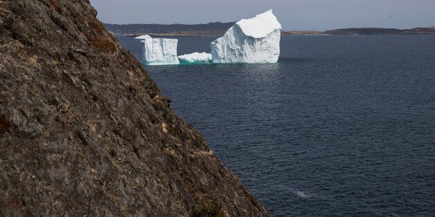 PORT KIRWAN, NEWFOUNDLAND - APRIL 26: An iceberg floats in the Atlantic Ocean, April 26, 2017 off the coast of Port Kirwan, Newfoundland, Canada. Icebergs break off from Baffin Island and Greenland every spring and drift down the stretch of water along the coast of Newfoundland and Labrador known as Iceberg Alley. According to media reports, the higher number of icebergs this season can be attributed to uncommonly strong counter-clockwise winds that draw the icebergs south and possibly global warming, which could be making Greenland's ice sheet melt faster. (Photo by Drew Angerer/Getty Images)
