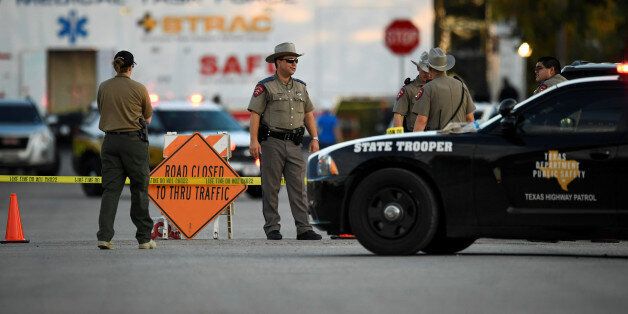 Law enforcement officials set up along a street near the First Baptist Church after a mass shooting in Sutherland Springs, Texas, US., November 5, 2017. REUTERS/Mohammad Khursheed
