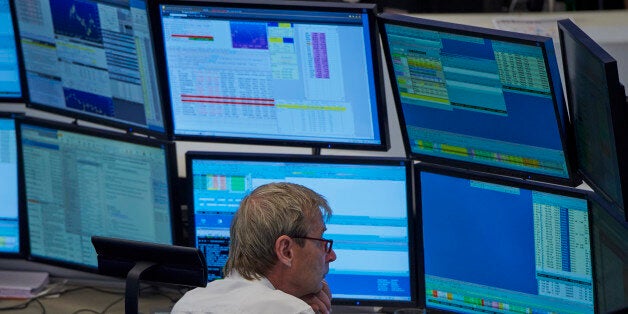 Floor trading at the German Stock Exchange in Frankfurt, Germany, 06 July 2015. Stocks and bonds in Europe fell after Greece's voters set the country on a collision course with the rest of the eurozone. Greeks voted 'No' to EU, ECB and IMF policies. DAX index is down by almost 1.5 percent a by midafternoon. (Photo by Horacio Villalobos/Corbis via Getty Images)