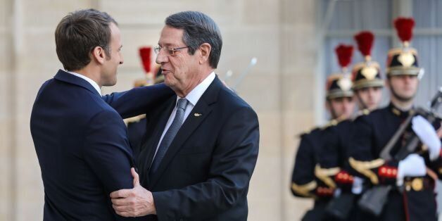 French President Emmanuel Macron (L) welcomes his Cypriot counterpart Nicos Anastasiades upon his arrival for their meeting at the Elysee palace on November 6, 2017 in Paris. / AFP PHOTO / ludovic MARIN (Photo credit should read LUDOVIC MARIN/AFP/Getty Images)
