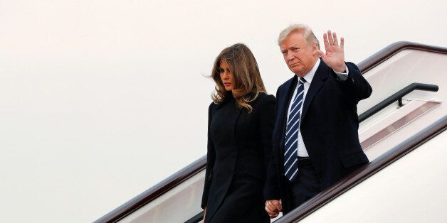 U.S. President Donald Trump and first lady Melania arrive on Air Force One at Beijing, China, November 8, 2017. REUTERS/Jonathan Ernst