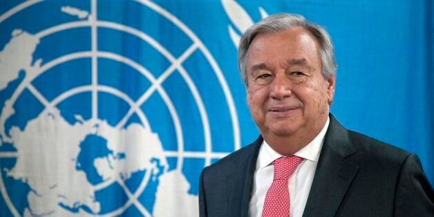 United Nations (UN) Secretary General Antonio Guterres poses at a United Nations Multidimensional Integrated Stabilization Mission in The Central African Republic (MINUSCA) lockbase in Bangui on October 26, 2017. Guterres is on his third day of a four-day visit to Central African Republic, where he is due to attend talks on political dialogue, meet religious and civil society leaders, attend large-scale meeting with police and military units of UN peacekeeping force. / AFP PHOTO / FLORENT VERGNES (Photo credit should read FLORENT VERGNES/AFP/Getty Images)
