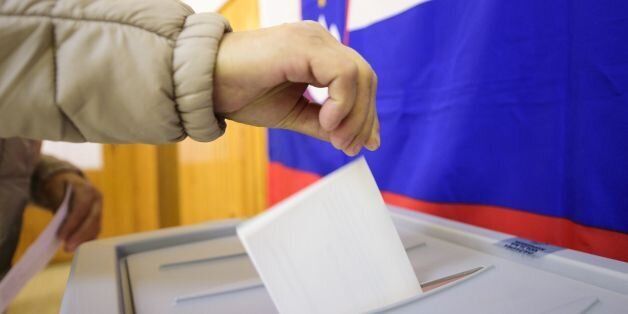 A slovenian citizen casts her ballot for the first round of the presidential election at a polling station in Ljubljana, on October 22, 2017.Slovenian citizens started voting on October 22 in a presidential election in which incumbent head of state Borut Pahor was expected to be re-elected. Some 1.7 million citizens were eligible to cast their vote, with partial results expected later in the evening. / AFP PHOTO / Jure Makovec (Photo credit should read JURE MAKOVEC/AFP/Getty Images)
