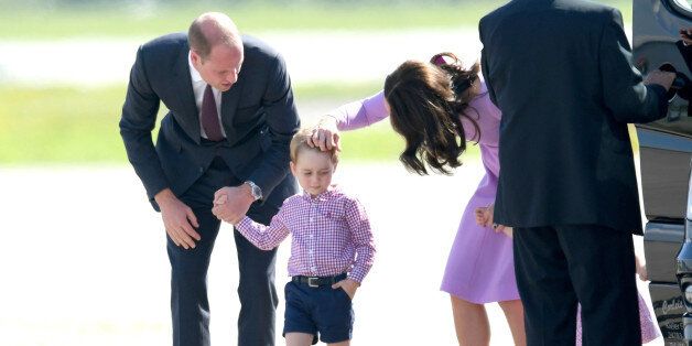 HAMBURG, GERMANY - JULY 21: Prince William, Duke of Cambridge, Prince George, Princess Charlotte of Cambridge and Catherine, Duchess of Cambridge view helicopter models H145 and H135 before departing from Hamburg airport on the last day of their official visit to Poland and Germany on July 21, 2017 in Hamburg, Germany. (Photo by Karwai Tang/WireImage)