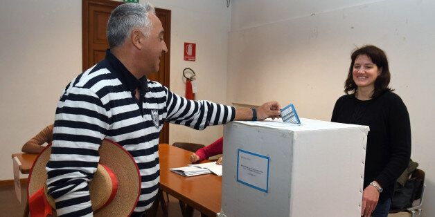 A gondoliere casts his ballot at a polling station during an autonomy referendum in Venice, on October 22, 2017. The consultative votes are only the beginning of a process which could, over time, lead to powers being devolved from Rome. Secessionist sentiment in the two wealthy northern regions is restricted to fringe groups with little following. / AFP PHOTO / ANDREA PATTARO (Photo credit should read ANDREA PATTARO/AFP/Getty Images)