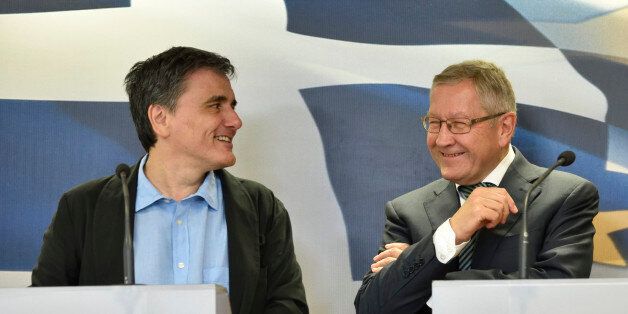 ATHENS, GREECE - JUNE 21: Greek Finance Minister Euclid Tsakalotos (L) and ESM Managing Director Klaus Regling attend a press conference held in the Ministry of Finance on June 21, 2016 in Athens, Greece. (Photo by Nicolas Koutsokostas/Corbis via Getty Images)