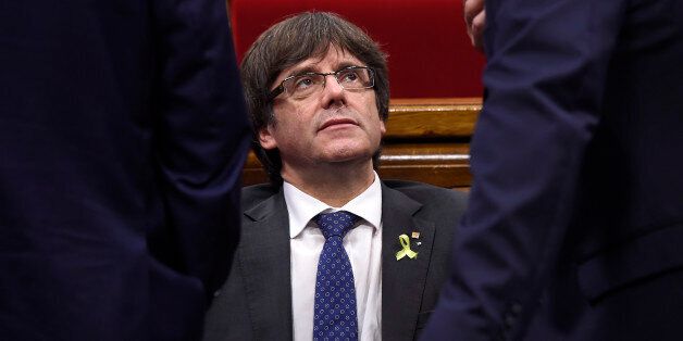 Catalan president Carles Puigdemont attends a session of the Catalan parliament in Barcelona on October 27, 2017. The Catalan parliament will vote on how to respond to the central government's planned takeover of Catalan political powers following an outlawed independence referendum. / AFP PHOTO / Josep LAGO (Photo credit should read JOSEP LAGO/AFP/Getty Images)
