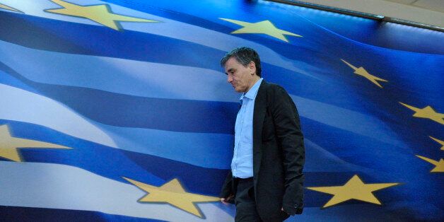ATHENS, GREECE - JUNE 21: Greek Finance Minister Euclid Tsakalotos (L) attends a press conference held alongside ESM Managing Director Klaus Regling (not pictured) in the Ministry of Finance on June 21, 2016 in Athens, Greece. (Photo by Nicolas Koutsokostas/Corbis via Getty Images)