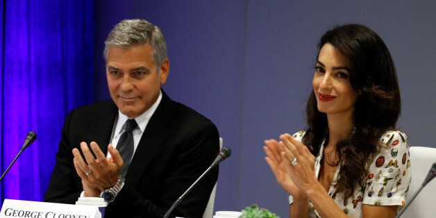 Actor George Clooney and his wife Amal attend a CEO roundtable at the United Nations during the United Nations General Assembly in New York September 20, 2016. REUTERS/Kevin Lamarque