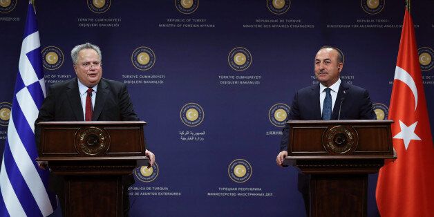 Turkish Foreign Minister Mevlut Cavusoglu (R) and Greek Foreign Minister Nikos Kotzias (L) hold a joint press conference after their meeting in Ankara on October 24, 2017. / AFP PHOTO / ADEM ALTAN (Photo credit should read ADEM ALTAN/AFP/Getty Images)