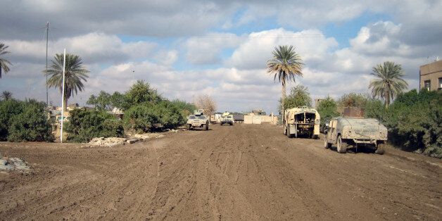 'Mud-clogged road in Ramadi, Iraq'