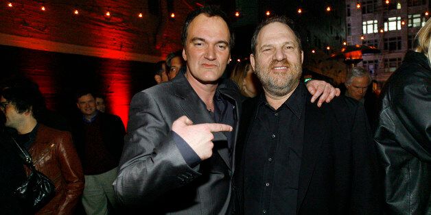 Director Quentin Tarantino (L) points at producer Harvey Weinstein at the after-party for the premiere of