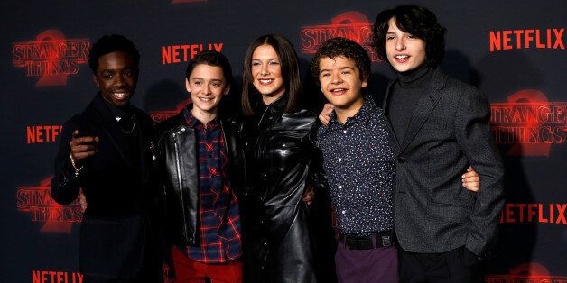 Cast members (L-R) Caleb McLaughlin, Noah Schnapp, Millie Bobby Brown, Gaten Matarazzo and Finn Wolfhard pose at the premiere for the second season of the television series