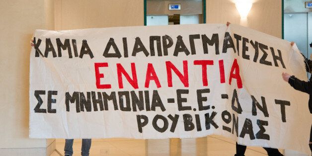 âRouvikonas' anarchist group invades the Hilton Hotel. Greece, Athens 16 March 2016. The âRouvikonas' anarchist group has reportedly staged an invasion in the Hilton Hotel in Athens, where the negotiations are carried out between Greek government officials and the institutions. About 12 members of the group managed to throw fliers urging the people to wage a war on domestic and international capital.Reports indicate that 12 people have been detained by the police.Police detained all 12