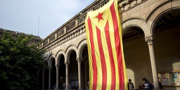 BARCELONA, SPAIN - SEPTEMBER 22: Pro-independence students displayed a Catalan flag at the central University of Barcelona as they gather at the rectorate of the University of Barcelona in support of the referendum of the Catalonia's self-determination on 1 October in Barcelona, Spain on September 22, 2017. (Photo by Albert Llop/Anadolu Agency/Getty Images)