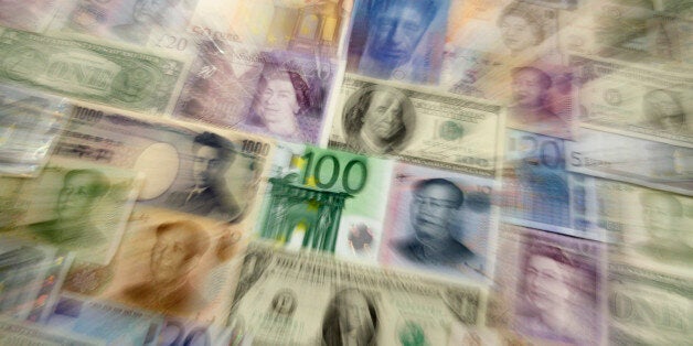 Arrangement of various world currencies including Chinese Yuan, Japanese Yen, US Dollar, Euro, British Pound, Swiss Franc and Russian Rouble pictured in Warsaw January 26, 2011. REUTERS/Kacper Pempel (POLAND - Tags: BUSINESS)