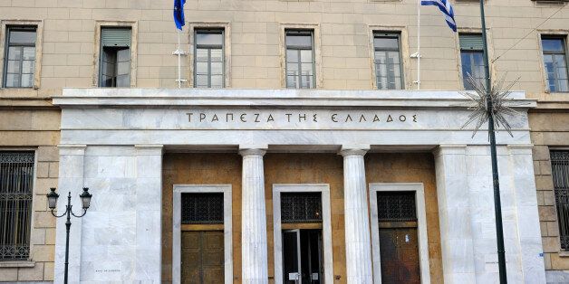 Athens, Greece - November 4, 2011: Entrance and part of the BANK OF GREECE building in Athens. It is the central bank of the country. Was established in 1927