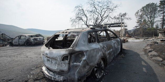 The remains of a burnt vehicle in front of a house in Sonoma County, California after the recent devastating fire. The wineries in the area are known for producing wine and wine tasting, October 17, 2017. (Photo by Yichuan Cao/NurPhoto via Getty Images)
