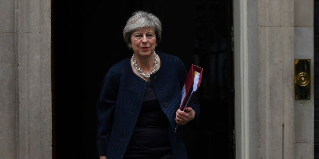 Britain's Prime Minister Theresa May leaves for the weekly Prime Minister Question (PMQ) session in the House of Commons, from Downing Street in central London on October 18, 2017. (Photo by Alberto Pezzali/NurPhoto via Getty Images)