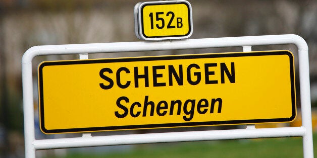 A street sign marks the beginning of the village of Schengen, Luxembourg January 27, 2016. The Schengen Agreement with the goal to eliminate internal border controls was signed on June 14, 1985 in the small village at the river Moselle and the tripoint of France, Germany and Luxembourg between the five countries of Belgium, France, Germany, Luxembourg and the Netherlands. European Union interior ministers are to discuss extending temporary border controls in the passport-free Schengen zone to control migration flows, as well as identity document fraud following France's request to improve the detection of fake Syrian passports used by people trying to get into Europe. REUTERS/Wolfgang Rattay