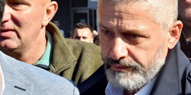 Naser Oric, wartime commander of Bosnian Muslim forces in the area of Srebrenica and Bratunac, leaves court in Sarajevo on October 9, 2017. A Sarajevo court acquitted Naser Oric, a commander revered by many as the defender of Muslims during Bosnia's 1990s conflict but viewed as a butcher by Serbs, of war crimes charges. Oric, 50, was bodyguard to former Yugoslav president Slobodan Milosevic and is one of only a few Bosnian Muslim commanders to have faced trial for atrocities committed against Serbs. / AFP PHOTO / ELVIS BARUKCIC (Photo credit should read ELVIS BARUKCIC/AFP/Getty Images)