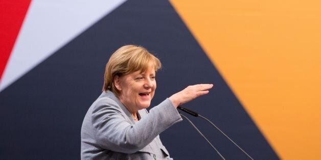 German Chancellor, Angela Merkel speaks during a campaign meeting of her Christian Democratic Union (CDU) party two days ahead of the state election in Lower Saxony on October 13, 2017 in Osnabruck. / AFP PHOTO / dpa / Friso Gentsch / Germany OUT (Photo credit should read FRISO GENTSCH/AFP/Getty Images)