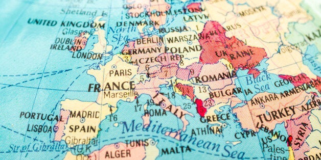 Macro close-up image of an unidentified map of Europe in color with surrounding borders