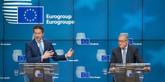 Jeroen Dijsselbloem, Dutch finance minister and head of the group of euro-area finance ministers, left, speaks as Klaus Regling, managing director of the European Stability Mechanism, listens on during a news conference following a Eurogroup meeting of finance ministers in Brussels, Belgium, on Monday, Feb. 20, 2017. As Greek efforts to conclude a year-old review of its rescue program stall, the governments ability to regain access to the public debt market grows slimmer, increasing the possibility Athens will have to seek another unpopular strings-attached bailout program. Photographer: Jasper Juinen/Bloomberg via Getty Images
