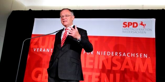 Lower Saxony's State Premier Stephan Weil of the Social democratic SPD party gives a speech after snap elections in the northwestern federal state of Lower Saxony, on October 15, 2017 in Hanover. In the state vote in Lower Saxony, home of Volkswagen, Martin Schulz's Social Democrats (SPD) clinched 37 to 37.5 percent of the vote, followed by Merkel's CDU at 35 percent, according to early results reported by public broadcasters ARD and ZDF. / AFP PHOTO / RONNY HARTMANN (Photo credit should