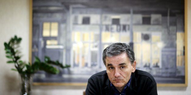 Greek Finance Minister Euclid Tsakalotos looks on during an interview with Reuters at his office in the ministry in Athens, Greece, December 2, 2015. Picture taken December 2, 2015. REUTERS/Alkis Konstantinidis