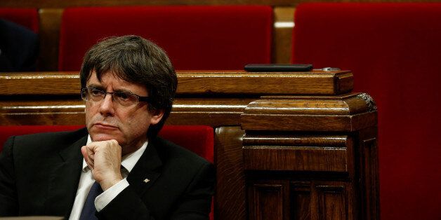 Catalan President Carles Puigdemont gestures during a plenary session in the Catalan regional parliament in Barcelona, Spain, October 10, 2017. REUTERS/Albert Gea