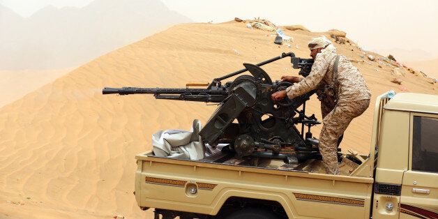 A Yemeni tribesman from the Popular Resistance Committees, supporting forces loyal to Yemen's Saudi-backed President, manoeuvrers a gun mounted on a pick up truck during fighting against Shiite Huthi rebels and their allies on June 30, 2017 in the area of Sirwah, west of Marib city.Six soldiers were killed in Yemen on June 29, a military source said, as government forces seek to cement their control over Marib province, east of the rebel-held capital. / AFP PHOTO / ABDULLAH AL-QADRY (Photo credit should read ABDULLAH AL-QADRY/AFP/Getty Images)