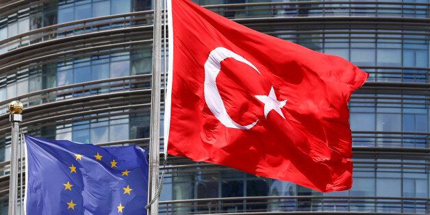 European Union (L) and Turkish flags fly outside a hotel in Istanbul, Turkey May 4, 2016. REUTERS/Murad Sezer/File Photo