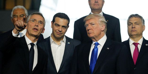 (L-R) NATO Secretary General Jens Stoltenberg, Greek Prime Minister Alexis Tsipras, U.S. President Donald Trump, Hungarian Prime Minister Voktor Orban and Britain's Prime Minister Theresa May pose during a family photo at the start of NATO summit at their new headquarters in Brussels, Belgium, May 25, 2017. REUTERS/Jonathan Ernst