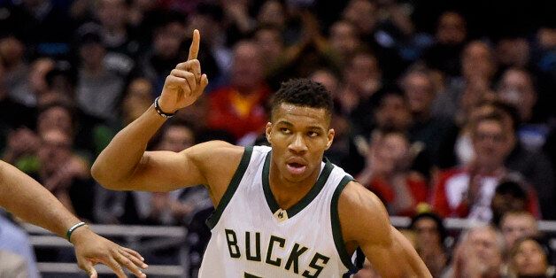 Jan 23, 2017; Milwaukee, WI, USA; Milwaukee Bucks forward Giannis Antetokounmpo (34) reacts after scoring a basket in the second quarter during the game against the Houston Rockets at BMO Harris Bradley Center. Mandatory Credit: Benny Sieu-USA TODAY Sports