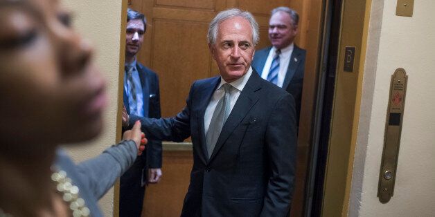 UNITED STATES - SEPTEMBER 06: Sens. Bob Corker, R-Tenn., center, and Tim Kaine, D-Va., make their way to the Senate Policy luncheons in the Capitol on September 6, 2017. (Photo By Tom Williams/CQ Roll Call)