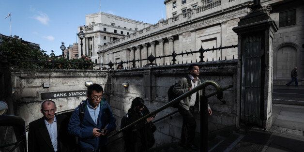 Pedestrians walk out of Bank London Underground station exit in view of the Bank of England (BOE) in the City of London, U.K., on Friday, Sept. 15, 2017. The pound climbed to the highest level against the dollar since just after the Brexit vote and gilts slid as Bank of England policy makerÂ Gertjan VliegheÂ stoked speculation of an interest-rate increase within months. Photographer: Simon Dawson/Bloomberg via Getty Images