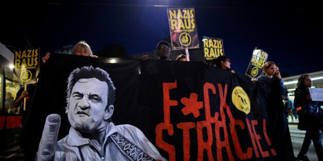 VIENNA, AUSTRIA - OCTOBER 13: Demonstrators carry signs reading 'Nazis get out' and 'Fuck Strache!' during a protest on October 13, 2017 in Vienna, Austria. Austria will hold legislative elections on October 15 and the conservative party (OeVP) of Sebastian Kurze is currently in the lead. The right-wing Austria Freedom Party (FPOe) is currently in a strong, third place in polls. Since the Austrian Social Democrats (SPOe) have indicated they will likely decline from joining a coalition with the conservative OeVP, the next Austrian government could well be a coalition that includes the FPOe, a party that has taken a hard stance against immigration and Islam. (Photo by Thomas Kronsteiner/Getty Images)