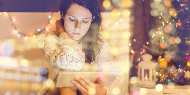 Girl using digital tablet at home