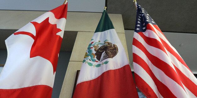 The Mexican, US and the Canadian flags sit in the lobby where the third round of the NAFTA renegotiations are taking place in Ottawa, Ontario, September 24, 2017. The negotiations will go between September 23-27, 2017 in Ottawa. / AFP PHOTO / Lars Hagberg (Photo credit should read LARS HAGBERG/AFP/Getty Images)