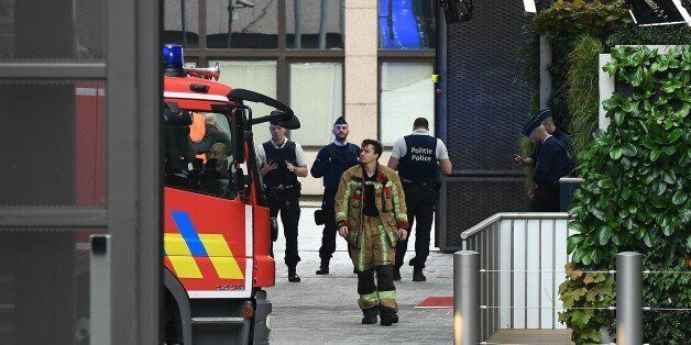 Belgian rescue personnel gather at The European Council in Brussels on October 13, 2017, after noxious fumes in the kitchen led to kitchen staff falling ill. Some 15 people were intoxicated following a ventilation problem in the kitchen of the Europa Building, the place were European leaders are due to meet October 19-20, 2017. / AFP PHOTO / EMMANUEL DUNAND (Photo credit should read EMMANUEL DUNAND/AFP/Getty Images)