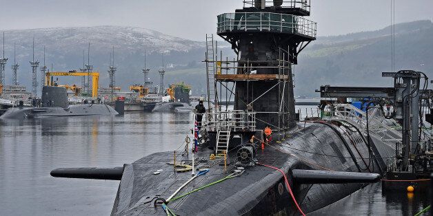 RHU, SCOTLAND - JANUARY 20: Royal Navy security personnel stand guard on HMS Vigilant at Her Majesty's Naval Base, Clyde on January 20, 2016 in Rhu, Scotland. HMS Vigilant is one of the UK's fleet of four Vanguard class nuclear-powered ballistic missile submarines carrying the Trident nuclear missile system. A decision on when to hold a key Westminster vote on renewing Trident submarine class is yet to be decided senior Whitehall sources have admitted. (Photo by Jeff J Mitchell/Getty Images)
