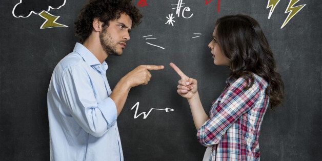 Discussion Between Guy And Girl Over Gray Background